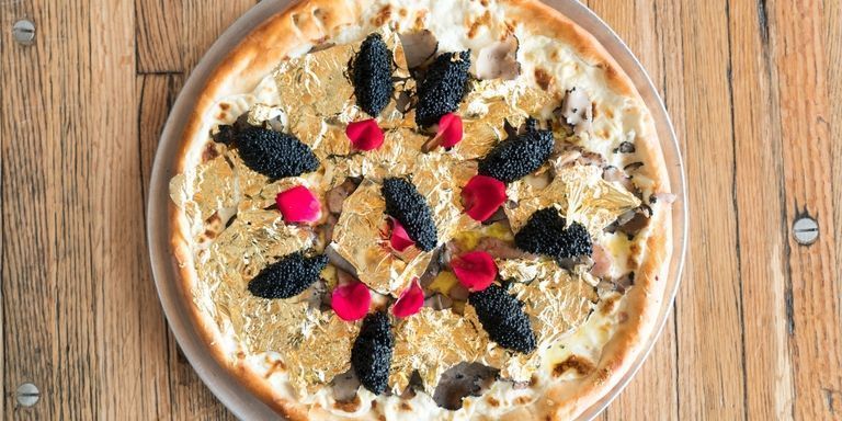 Industry kitchen pizza with 24k-gold flakes, foie gras, truffles, and caviar