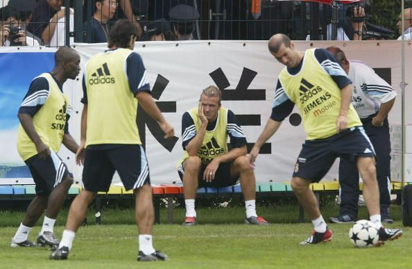 David Beckham of Real Madrid sits watching his team mates