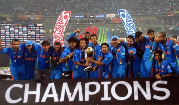 Indian team pose after winning the 2011 World Cup
