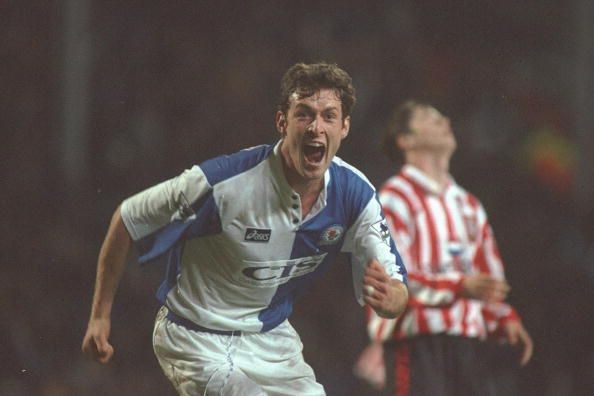 Chris Sutton of Blackburn turns to celebrate scoring