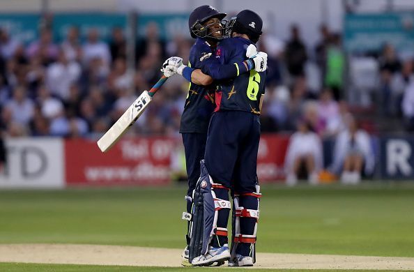 Daniel Bell-Drummond and Joe Denly celebrate scoring a world record opening during the Essex v Kent game