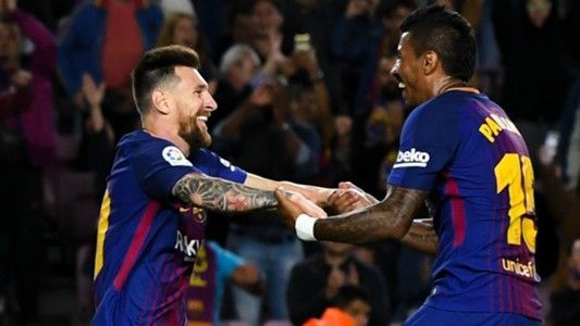Lionel Messi and Paulinho celebrate a Barcelona goal vs Eibar
