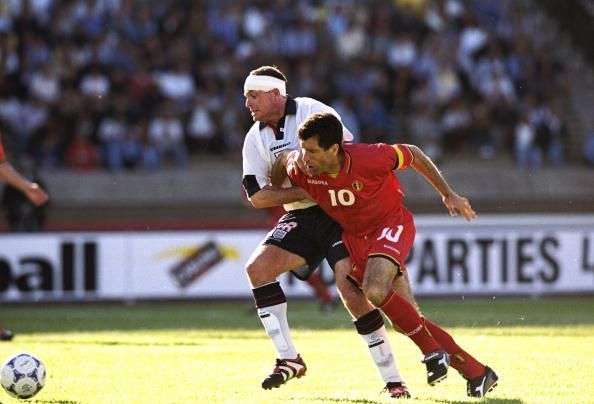 Paul Gascoigne of England battles with Belgian player Enzo Scifo