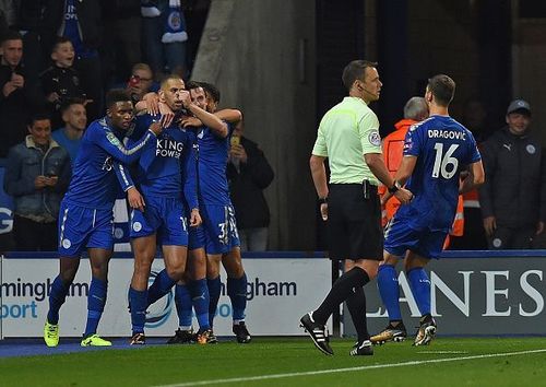 Leicester players celebrate Slimani's second goal