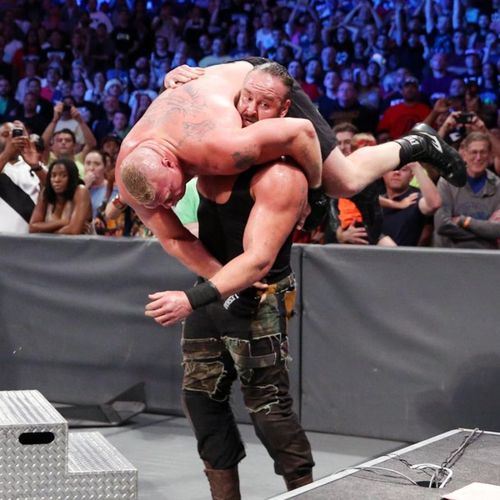 Braun Strowman getting ready to put Brock Lesnar through a table at Summerslam