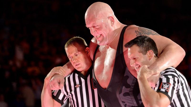 Big Show being helped to the back after his recent cage match