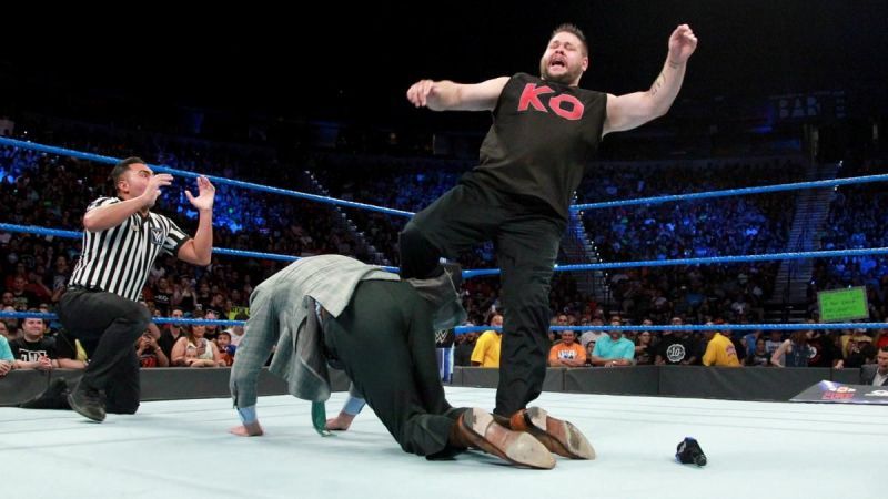 Kevin Owens viciously attacking Vince McMahon