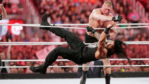Image result for wwe reigns and lesnar defeat each other