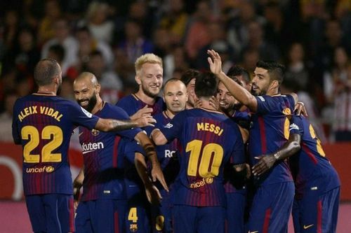 Barcelona players celebrating after Suarez's goal against Girona