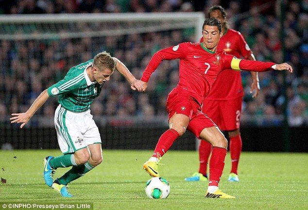 Ronaldo nutmegging Northern Ireland&#039;s captain Steven Davis.