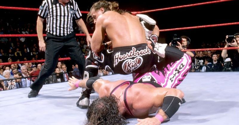 Shawn Michaels applies the Sharpshooter to Bret Hart