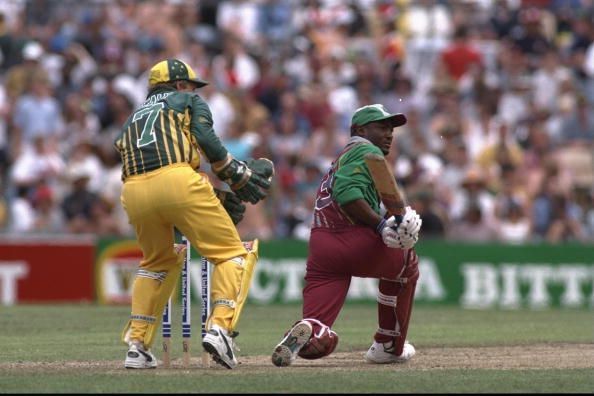 In a crucial game at the Gabba, West Indies made a challenging target look easy after centuries by Brian Lara and the mercurial Carl Hooper