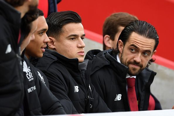 Coutinho watches the game from the sidelines 