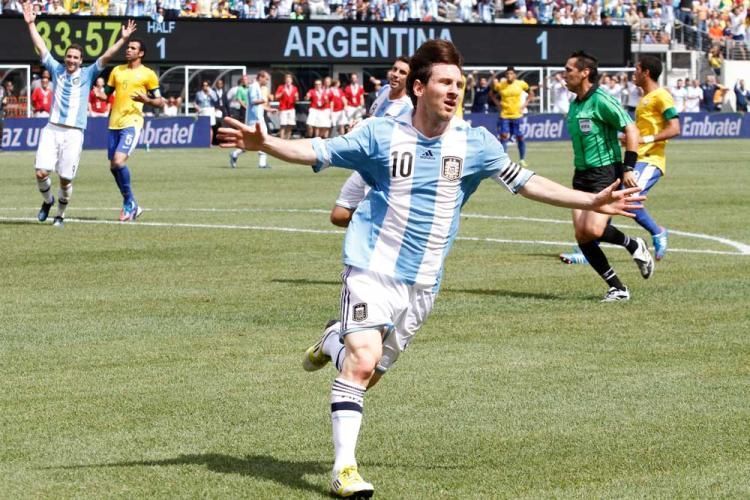 Messi celebrating after scoring against Brazil.