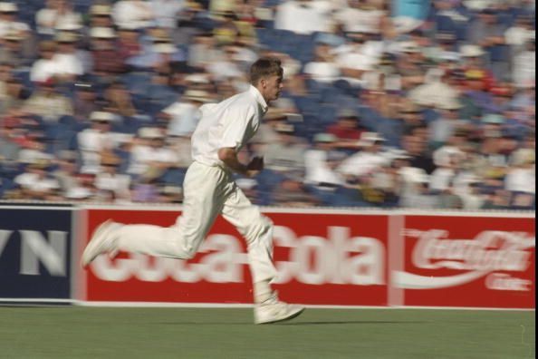 Glen McGrath runs upto the wicket to bowl