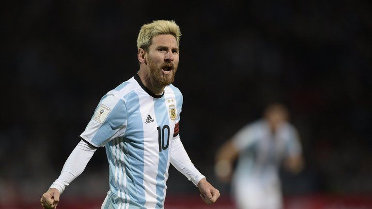 Messi celebrating after scoring against Uruguay.