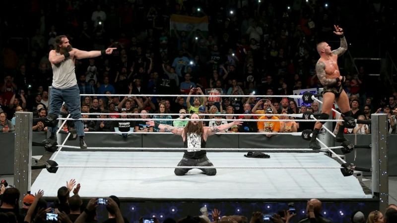 Wyatt and Orton celebrate with Luke Harper and claim victory for Team SmackDown LIVE.