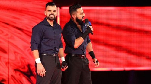 The Singh Brothers make their entrance for their match against Shinsuke Nakamura