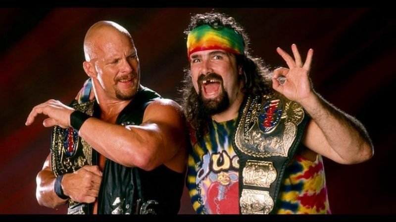Stone Cold and Dude Love with the Tag Team Championships