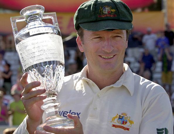 Steve Waugh holds aloft a replica of the Ashes urn