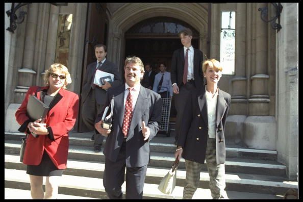 Allan Lamb (centre) leaves court with wife Lindsay (left) and Kathy Botham