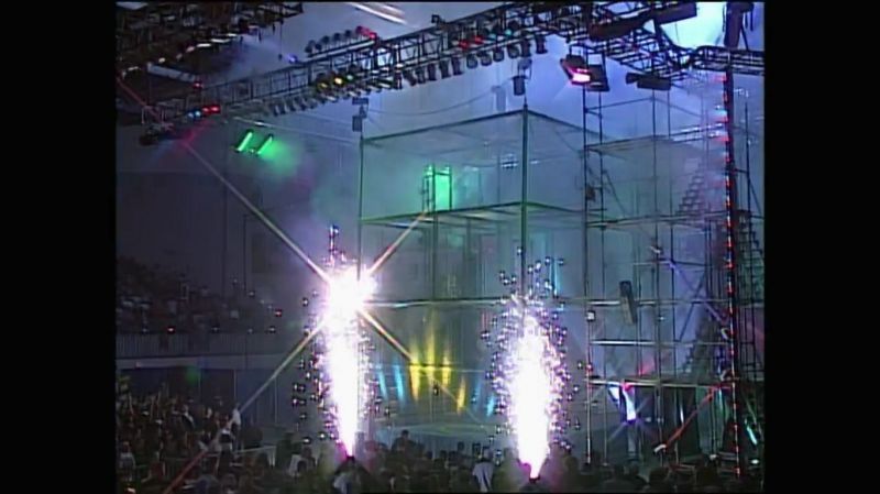 The cage gets an entrance, pyro, and unique theme music, but Ric Flair does not.