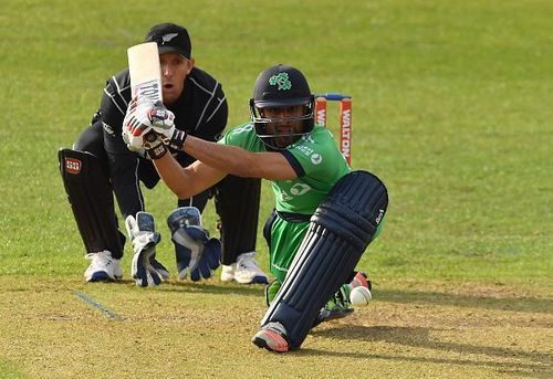 Debutant Simi Singh plays a sweep shot as New Zealand wicketkeeper Luke Ronchi watches