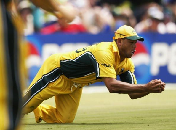 Andrew Symonds of Australia dives to catch a ball from Mohammad Kaif of India