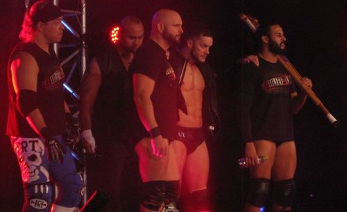 The Bullet Club prepares for battle during a New Japan Pro Wrestling event in 2013.