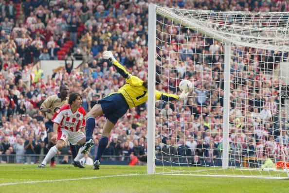 David Seaman of Arsenal makes a spectacular save to keep the ball out
