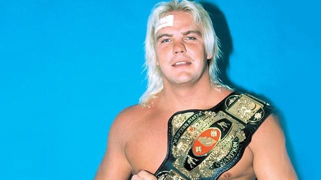 Barry Windham holding gold.