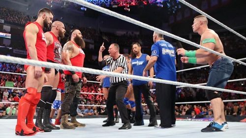 The two teams face off before the main event. John Cena is not a team player.