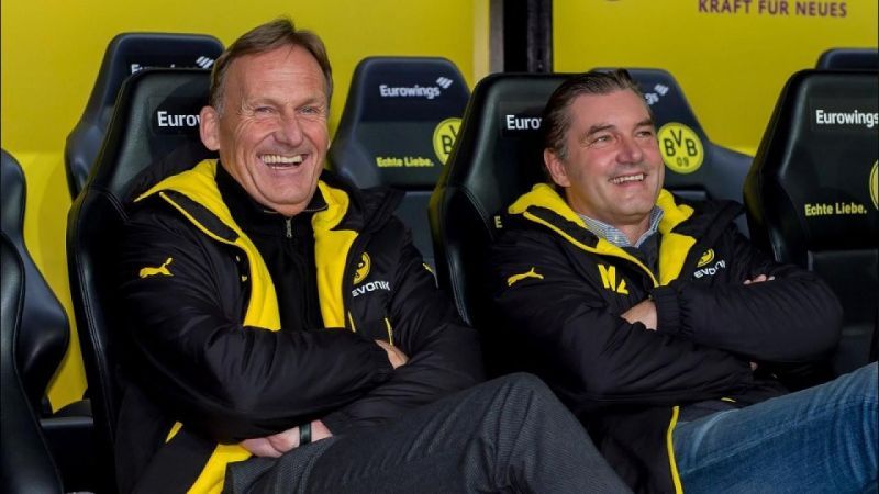 CEO Watzke (left) & sporting director Zorc have done well but must realize the enormity of the task at hand