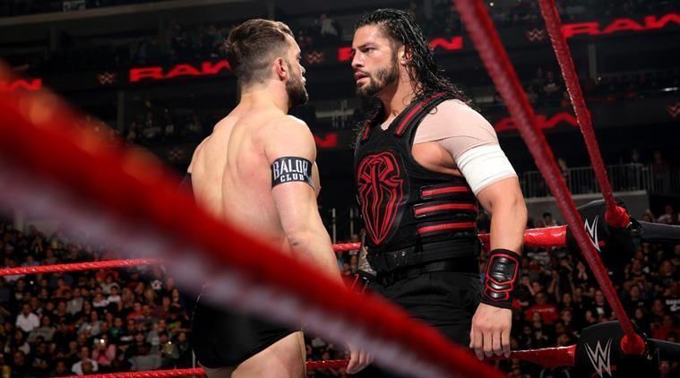 Finn Balor in the ring with Roman Reigns