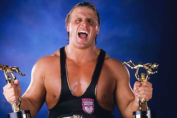 Owen Hart with his worthless Slammys