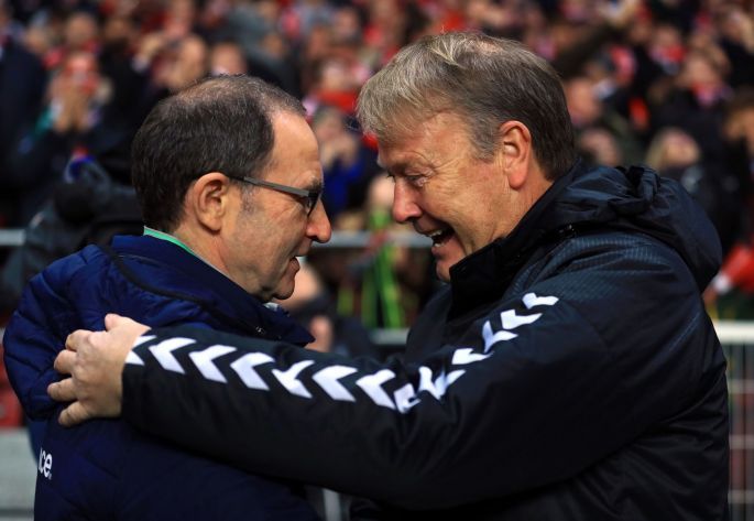 The two managers embrace before the game