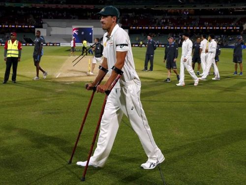 Australian quickie Mitchell Starc walking off the field following an injury to the right ankle.