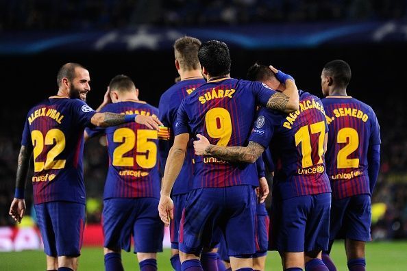 The Barca players celebrate their opening goal