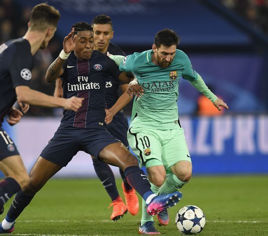 Presnel Kimpembe trying to tackle Lionel Messi. Image courtesy Essentially Sports