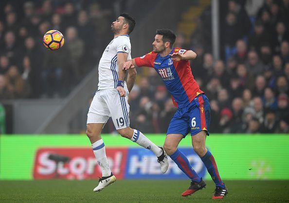 Scott Dann was nowhere near Costa who timed his jump perfectly.