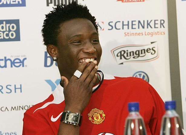 John Obi Mikel poses in a Manchester United shirt....before the move was hijacked by Chelsea