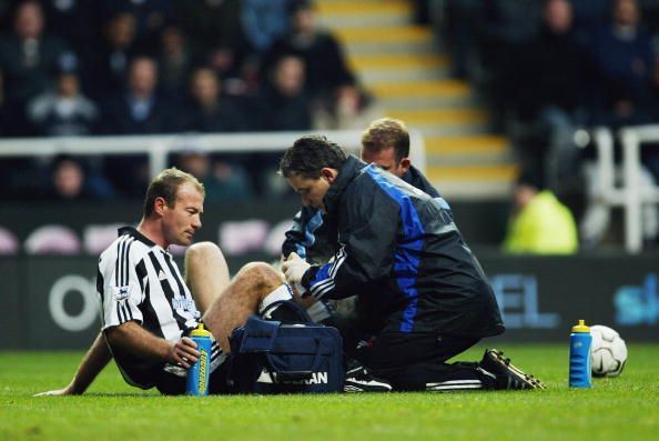 Alan Shearer of Newcastle United recieves treatment