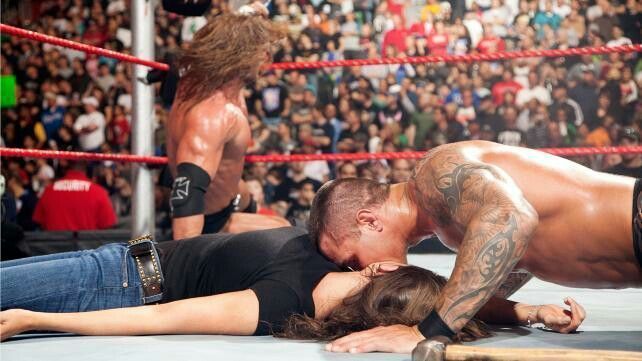 Orton kissed Stephanie as her helpless (and handcuffed) husband looked other side in disgust.