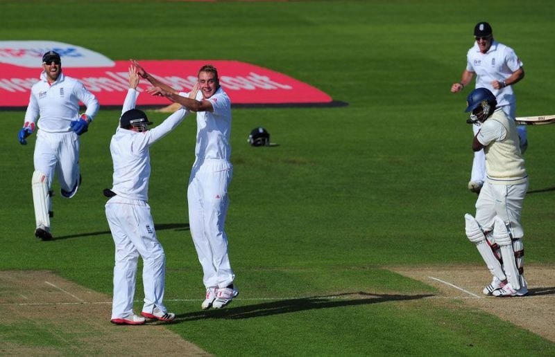 Stuart Broad celebrates with silly point fielder Ian Bell