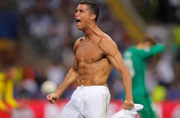 Ronaldo ripping his shirt off (again!) to show his muscular torso