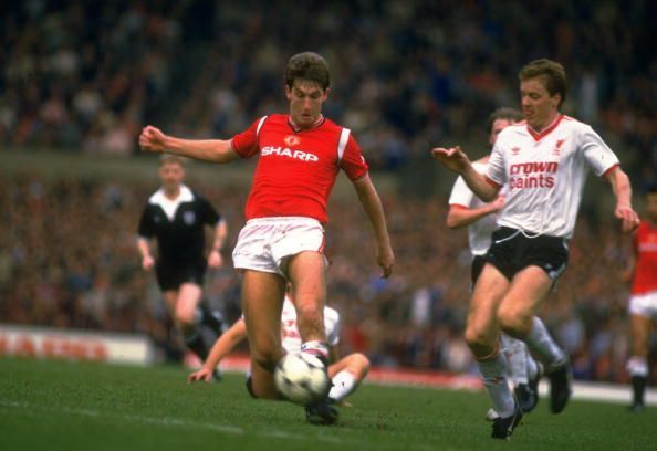 Norman Whiteside of manchester United and Steve Nicholl of Liverpool