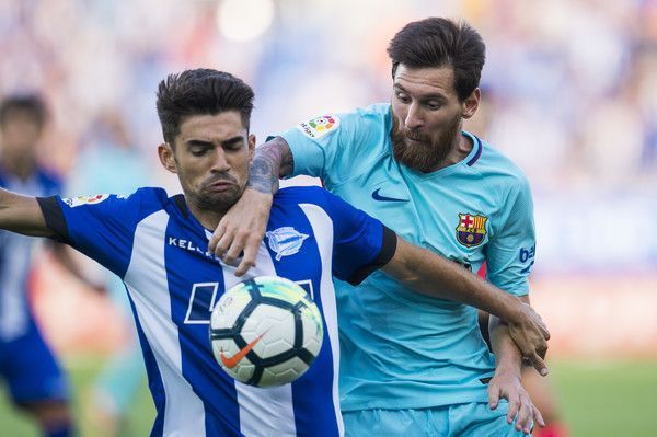 Lionel Messi of FC Barcelona duels for the ball with Enzo Zidane of Deportivo Alaves during the La Liga match between Deportivo Alaves and Barcelona at Estadio de Mendizorroza on August 26, 2017 in Vitoria-Gasteiz, Spain . (Aug. 25, 2017 - Source: Juan Manuel Serrano Arce/Getty Images Europe) 