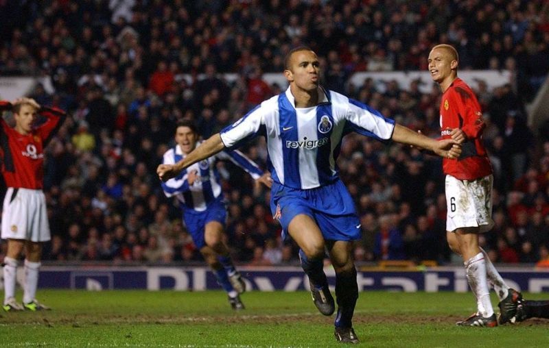 The other dash : Costinha takes off after his injury time goal at Old Trafford