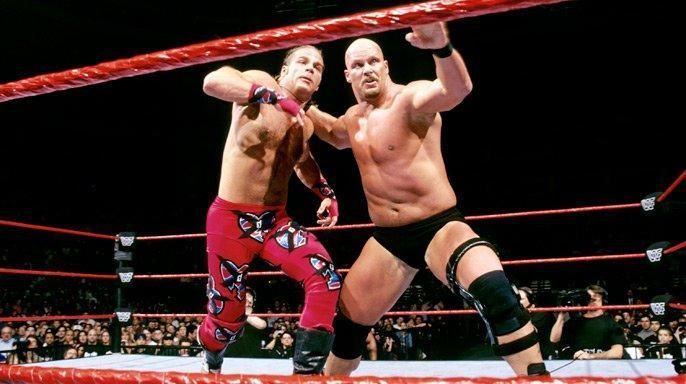 Stone Cold and Shawn Michaels square off in the ring at Wrestlemania XIV