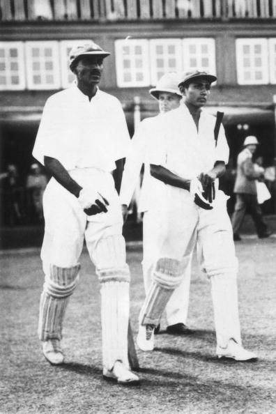 Lala Amarnath (right) walking in to bat.